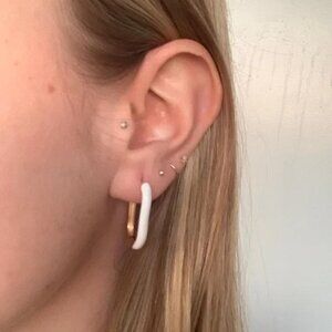 The Gia Grande Blanche gold enamel white oval hoop earrings hoops carabiner